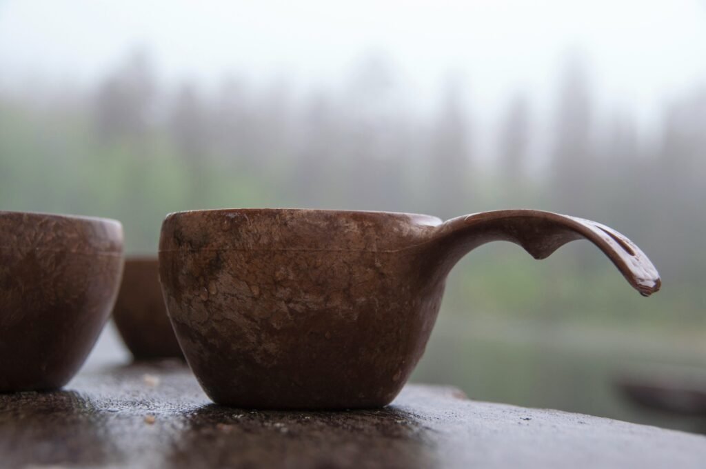 a couple of brown cups sitting on top of a table